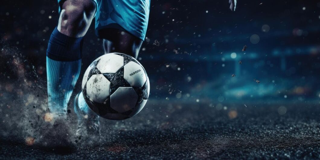 soccer player kicking football